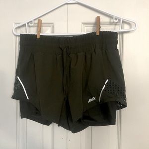 Avia. Size Xtra Small (0-2). Forest green running shorts with inside liner.